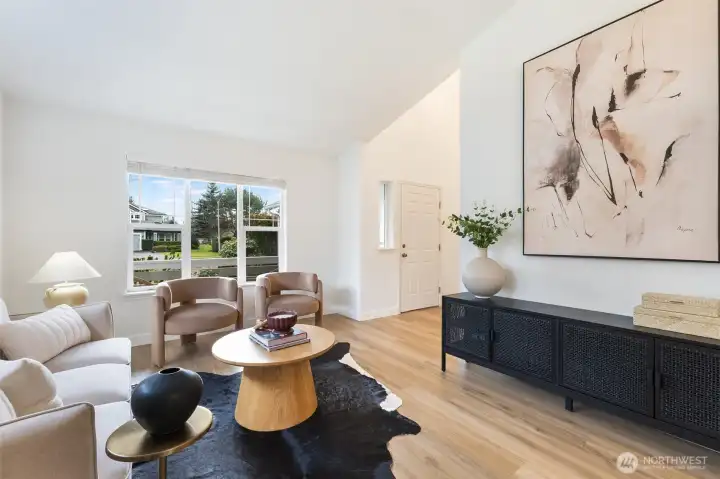 Large windows invite natural light to fill the room.