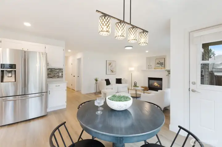 Casual dining area with access to the patio and backyard.