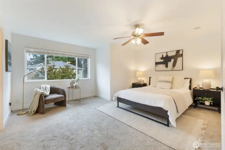 Spacious primary suite offers a true retreat.