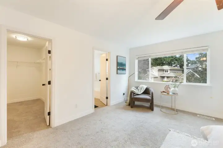 The primary bedroom features a walk-in closet and a private bath.