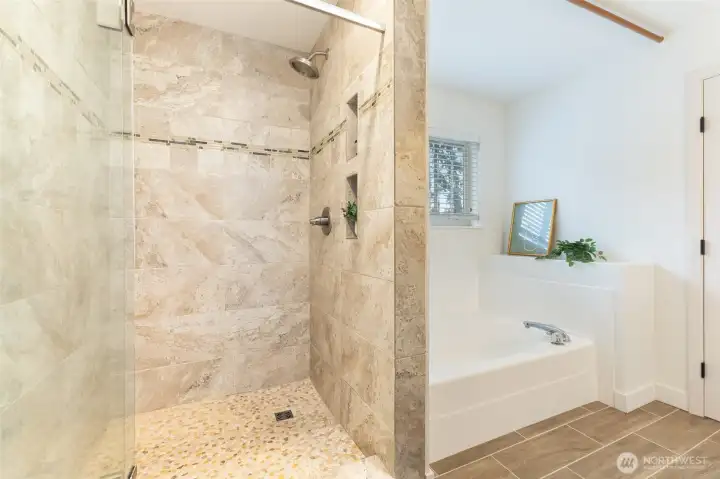 Separate shower offers modern functionality, while a soaking tub invites relaxation.