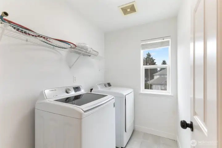 Convenient laundry room on upper level.
