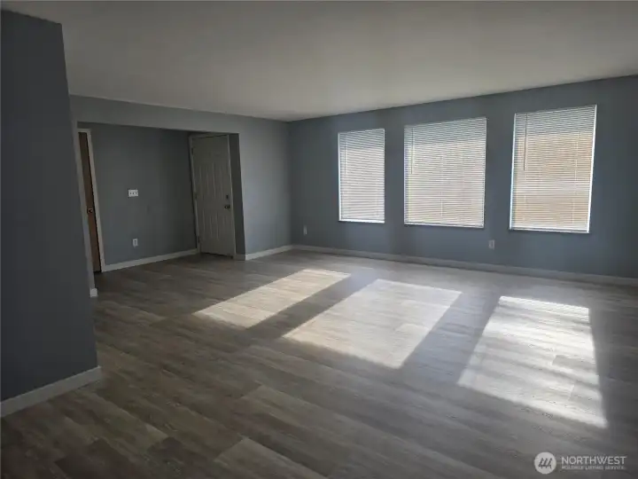 Living room with large south facing windows for lots of natural light