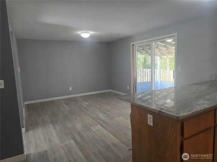 Family room off kitchen with access to covered patio