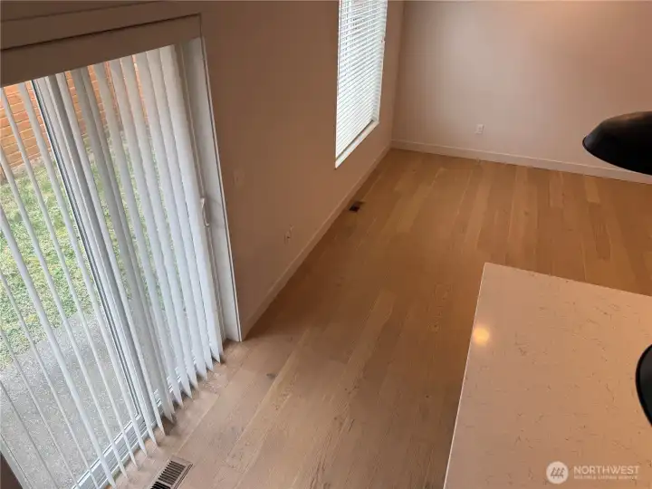 West wall in greatroom has the slider as well as a picture window.