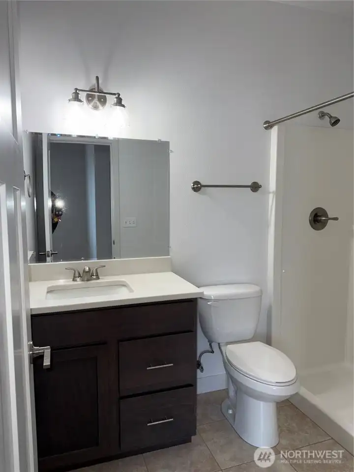 Walk in shower.  Quartz and nice cabnitry.