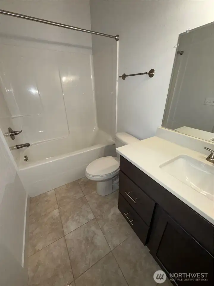 Bathroom with shower and tub.