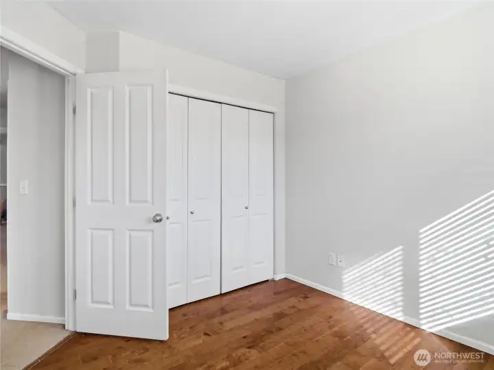 Upstairs bedroom 1- nine size closet and no carpet in the room