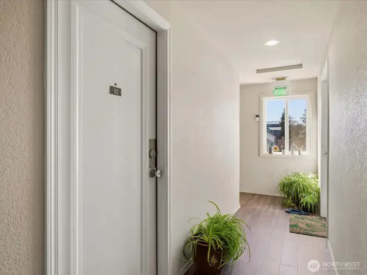 Top floor corner unit with North facing front door