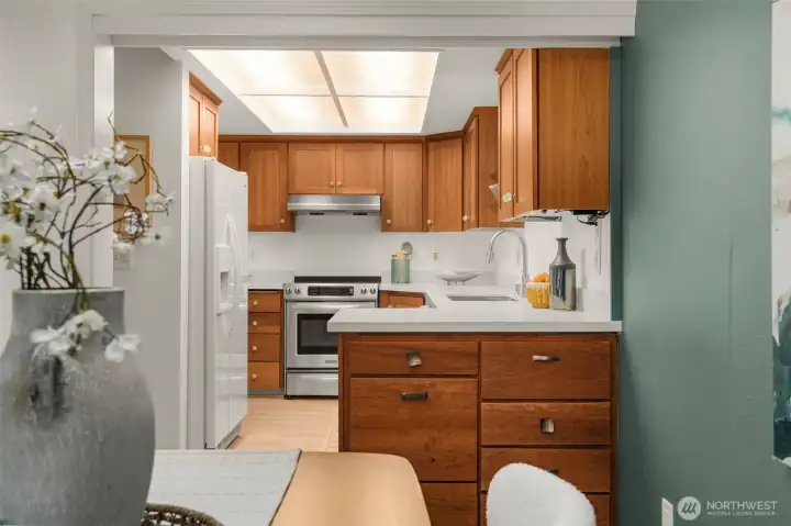 updated stone counters and paint in this super clean kitchen