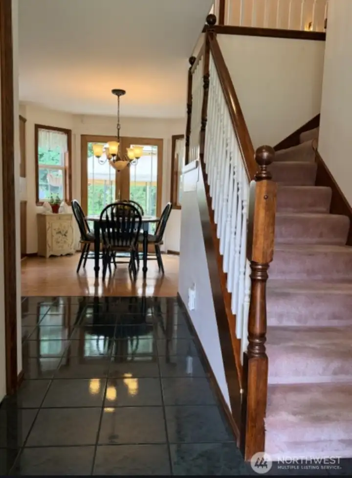Entry to this formal floor plan. Dining to left, front living room to the right. Kitchen with eating space in front of you and utility, half bath and den to the right.