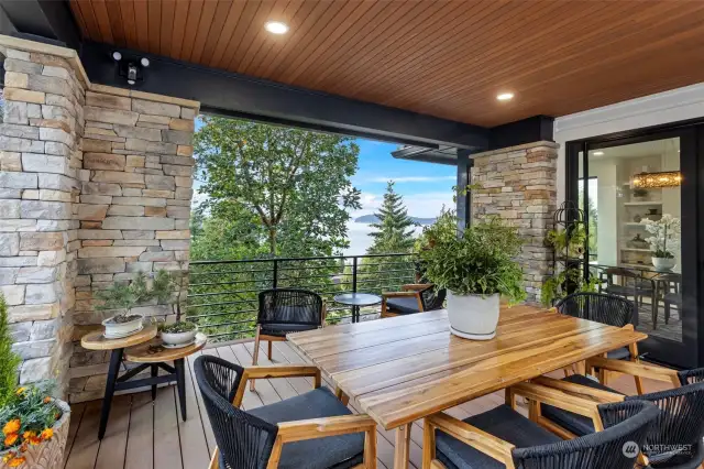 The deck is within steps and within view of the kitchen, but tucked in its own corner.