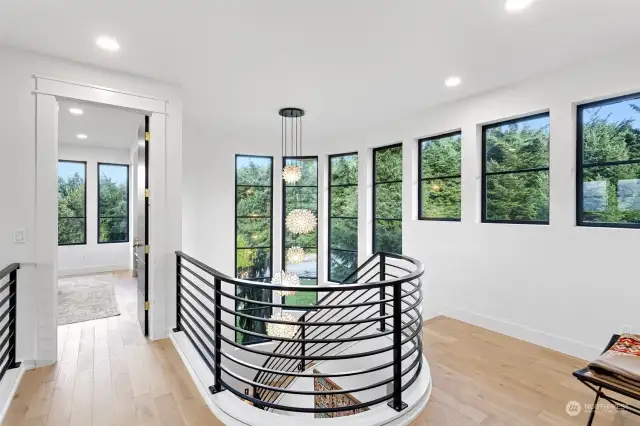 Overlooking the living room, the mountains appear to rise straight from the bay, offering an awe-inspiring view from every angle. The stairs are motion sensored so you never had to turn on a light as you descend them.