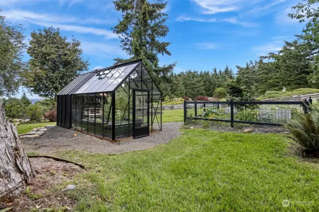 Nurture your green thumb here in this custom greenhouse. Walk down into the hollow and listen for wildlife in the ravine.  Here, so many places offer a private, quiet, hidden place to sit.