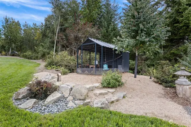 Walk past the hen house, up the side of the ravine and come out at the greenhouse and garden.