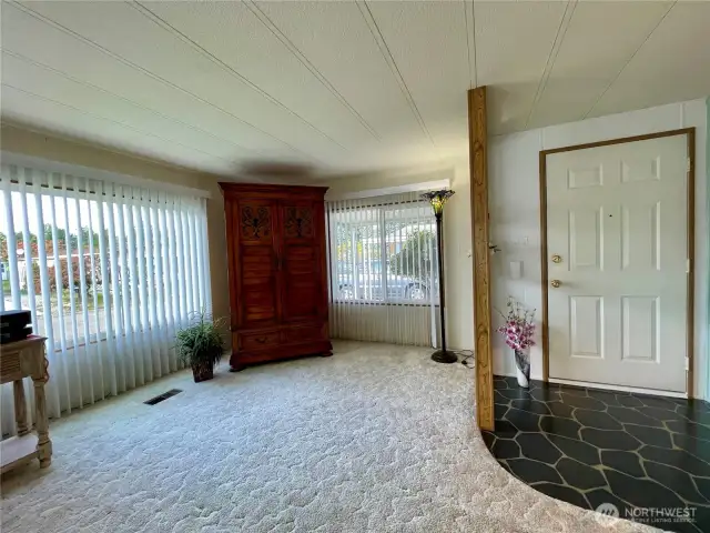 Living room with a view of the front entry.