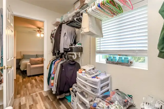The primary walk-in closet includes a window & electrical outlets and is so large it could double as an office. (UNIT 7917)