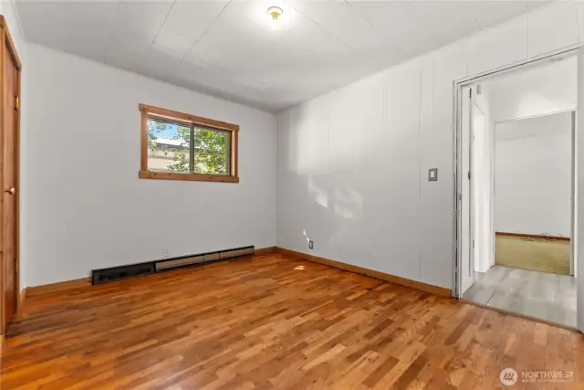 Primary bedroom hardwood floors.