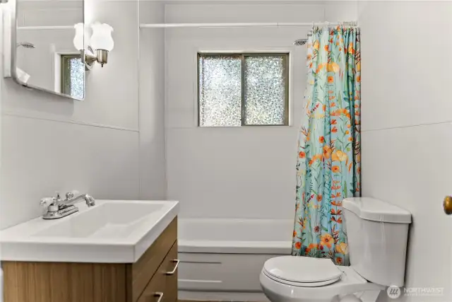 Full bath is updated with Vanity sink, Toilet and tub / shower.