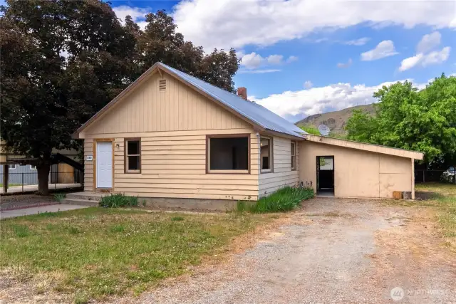 Driveway to Carport and storage workshop area.