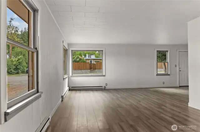 Fresh new paint in Living room with Vinyl plank floor.