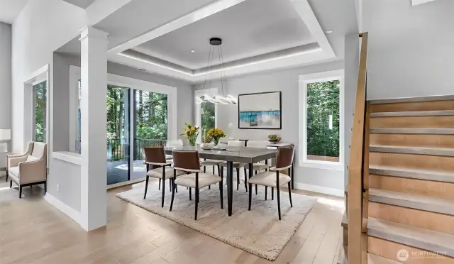 Dining Room with convenient access to the covered patio and peaceful backyard. Virtually staged.