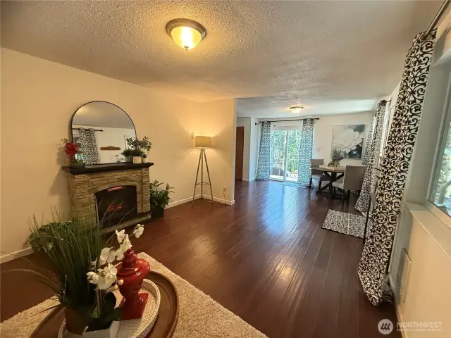 Electric fireplace and engineered hardwood floors throughout!