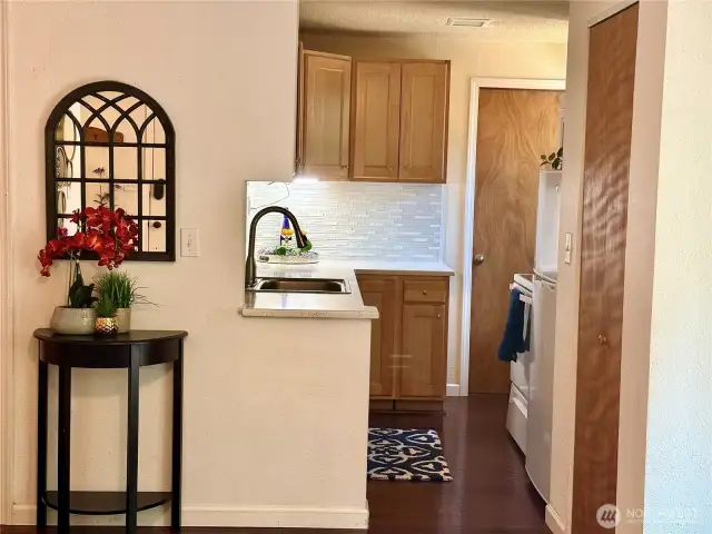 Beautifully updated backsplash and Corrian countertops.
