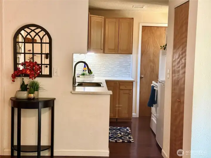 Beautifully updated backsplash and Corrian countertops.