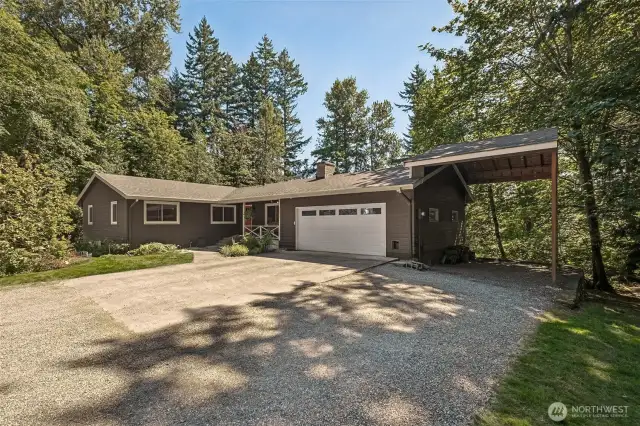Thanks to the large carport, there's covered parking for 4 cars - or your RV!