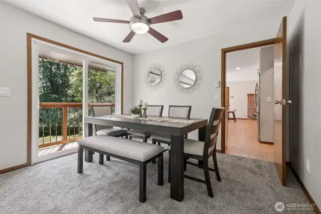 The formal dining area is just off the kitchen, and located perfectly next to French doors and the viewing deck.