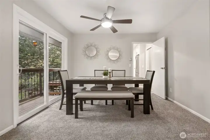 The formal dining area is just off the kitchen, and located perfectly next to French doors  and the viewing deck.