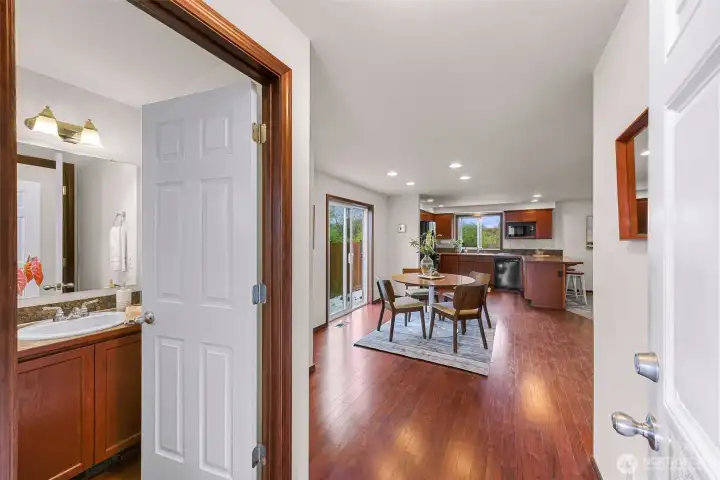Half bath to your left, see the slider door to the side yard?  Dining area at center, kitchen and living room will be to your right.