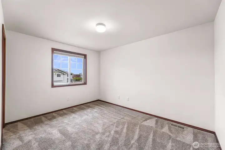 Bedroom #2 has one large west facing window and a walk in closet to your left.