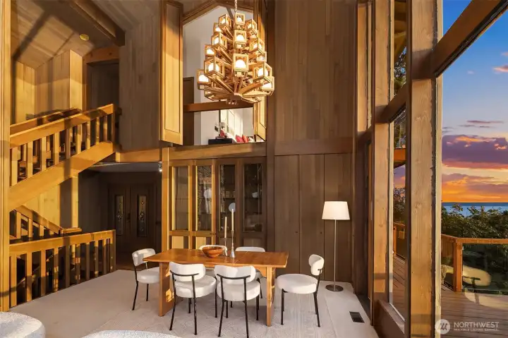 Entry door from the main level. Built-in cabinet hutch. The hallway leads into the kitche.