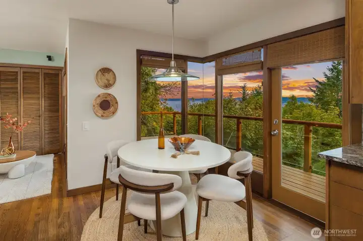 Dining room features a new door out to the main deck and leads into the sitting room.