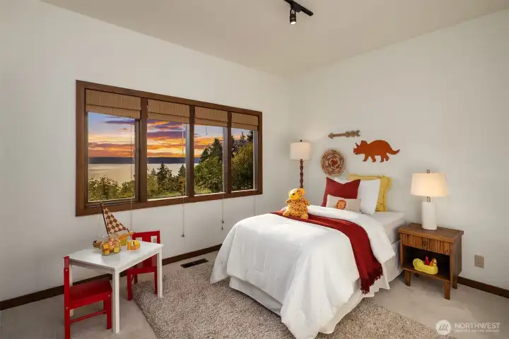 One of three bedrooms on the lower level with views. New carpet.