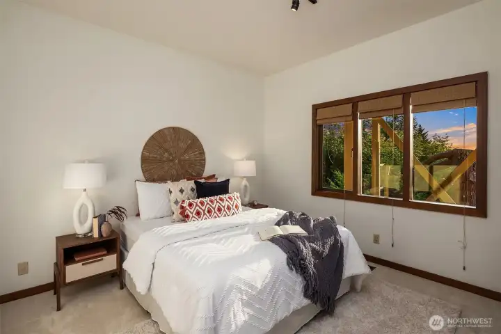Two of three bedrooms on the lower level with views. New carpet.