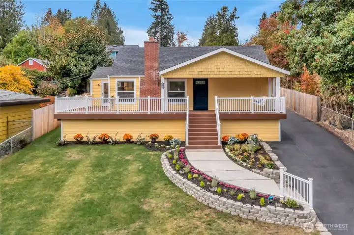 Worlds collide in the best way!  Perched on a hill for stature & views--level entry at rear; OWC yet fully updated.