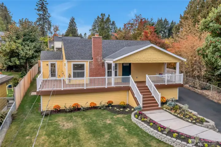 The front porch wraps around and opens to the kitchen.  The railing is composite, Fiberon and decking is Trex, siding is Hardi plank because it's a low maintenance kind of party!