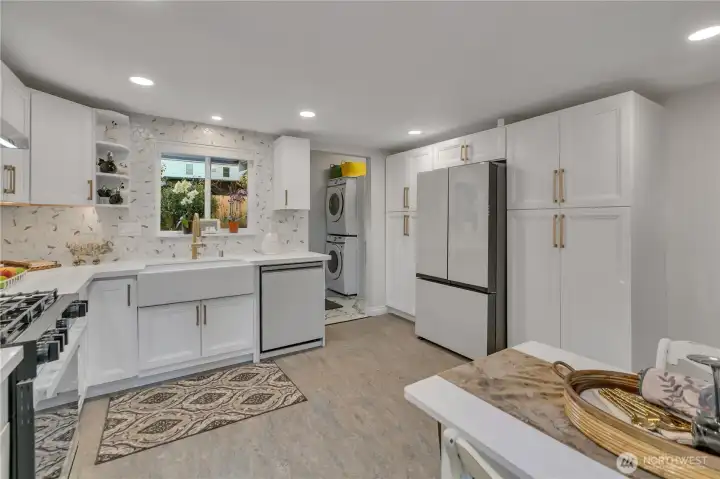 Farmhouse sink, Bespoke dishwasher and refrigerator and loads of cabinetry is nice but do you know Marmoleum?  That's the flooring by Forbo.  Made from all natural products, check it out.