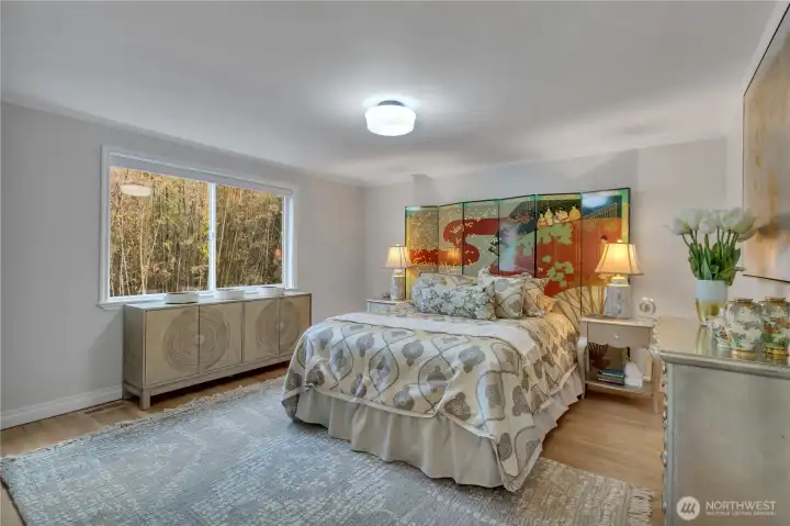 The primary bedroom with one very large window!  Did you notice how private the bedroom windows are?  Amazing.