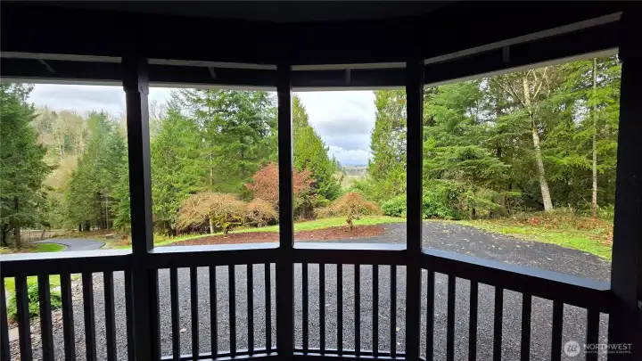 View from the front porch overlooking the beautifully, wooded surroundings and the newly paved private driveway.