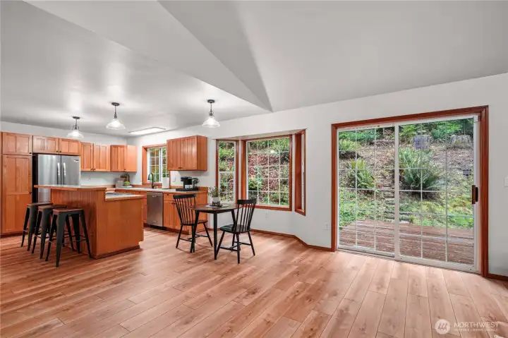 Spacious dining area between the kitchen and back sliding door. Creates great flow to the back deck for easy indoor/outdoor entertaining.