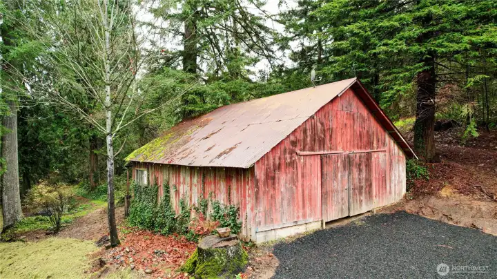 New black crushed rock driveway surfacing to barn and well. New 200' deep well with submersible pump.  Rustic barn offering a blank canvas for creative updates, storage or workshop space.