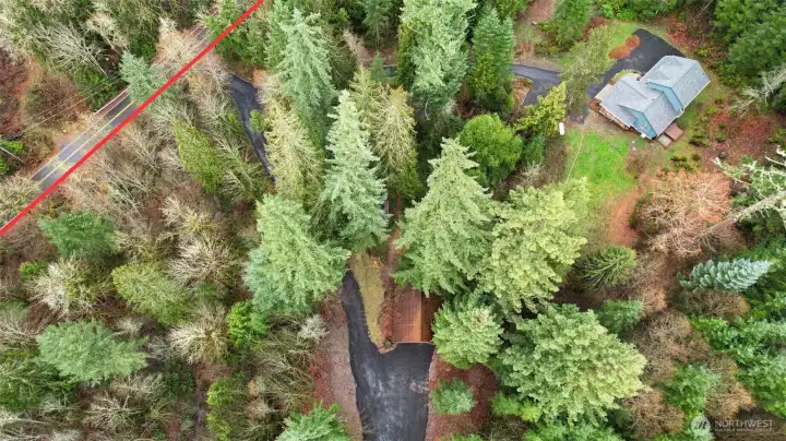 Photo showing Prather Road with driveway to home and driveway to barn. Peaceful, country like setting with easy access to town.