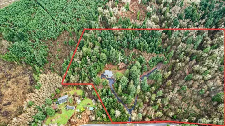 Ariel view of this expansive 20 acre property featuring a new, freshly paved driveway to the home and a new black crushed rock driveway to the barn. (boundaries shown are approximate)