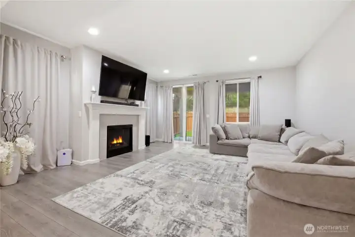 Dining room opens to living room with sliding door to covered patio