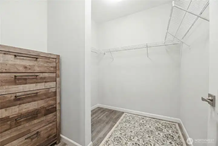 Walk-in closet for apartment bedroom on main floor with room for stackable washer/dryer