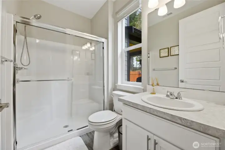 Main floor apartment bath with walk-in shower